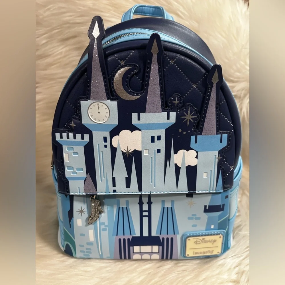 cinderella castle glow mini backpack Exclusive Holiday Light Up | Officially Licensed | Plastic/Vegan Leather where Jaq and Gus are decorating wreaths Cinderella Castle Glow Mini Backpack